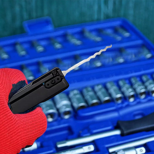 Essential stainless - steel multi - tool: quick - flip grav pick, door keys, lock rake. Durable.